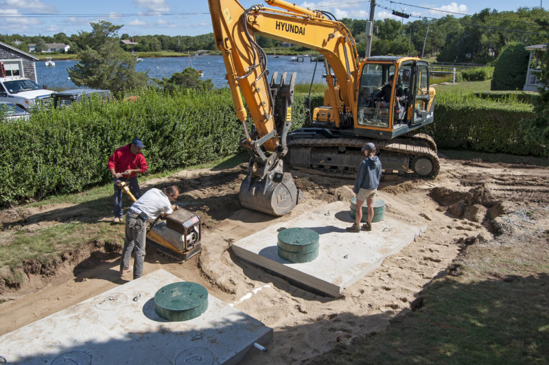 installation of nitrogen-reducing septic system at a home on West Falmouth Harbor