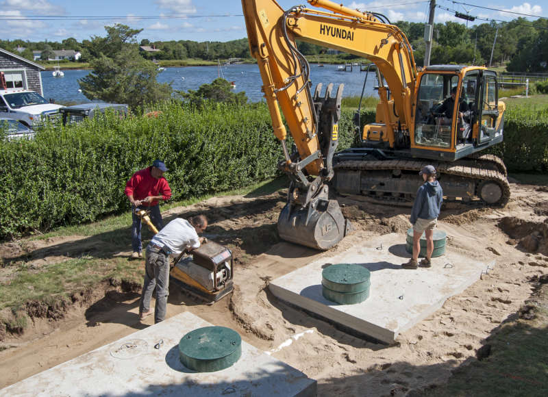 installation of nitrogen-reducing septic system at a home on West Falmouth Harbor