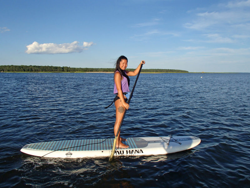 woman paddleboarding in Little Bay in Fairhaven
