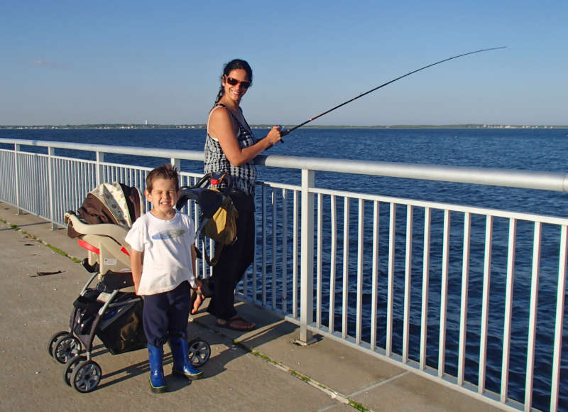 mother and son fishing from pier at Fort Taber in New Bedford