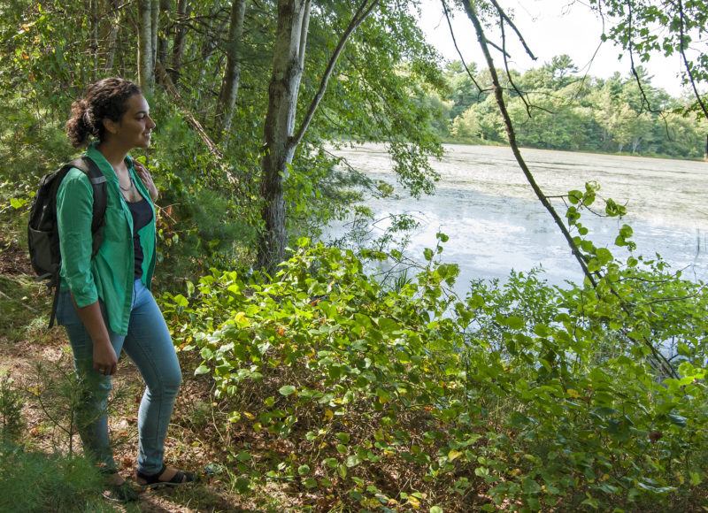 woman standing next to water at Rochester Wildlife Management Area