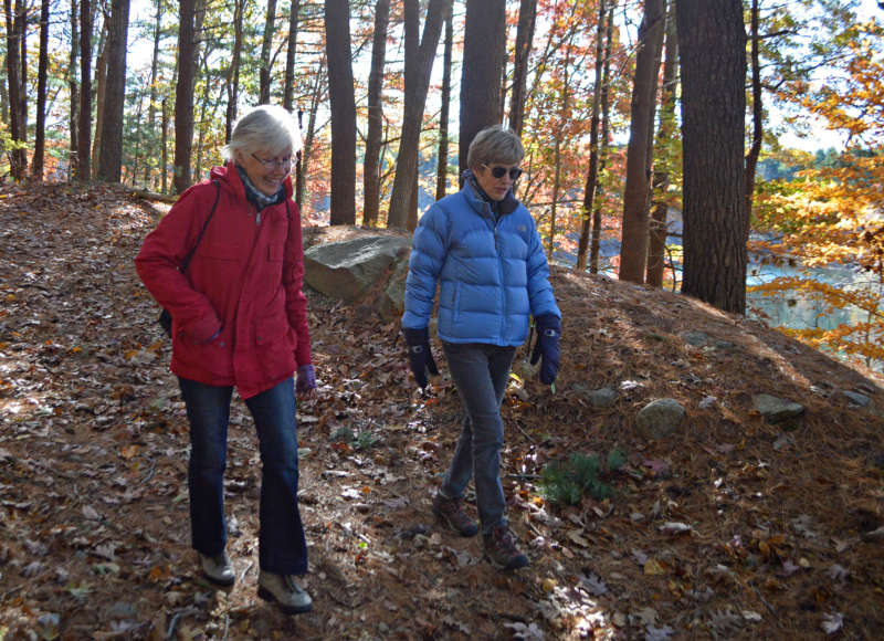 Two women walking on the Falmouth Moraine Trail at Long Pond.