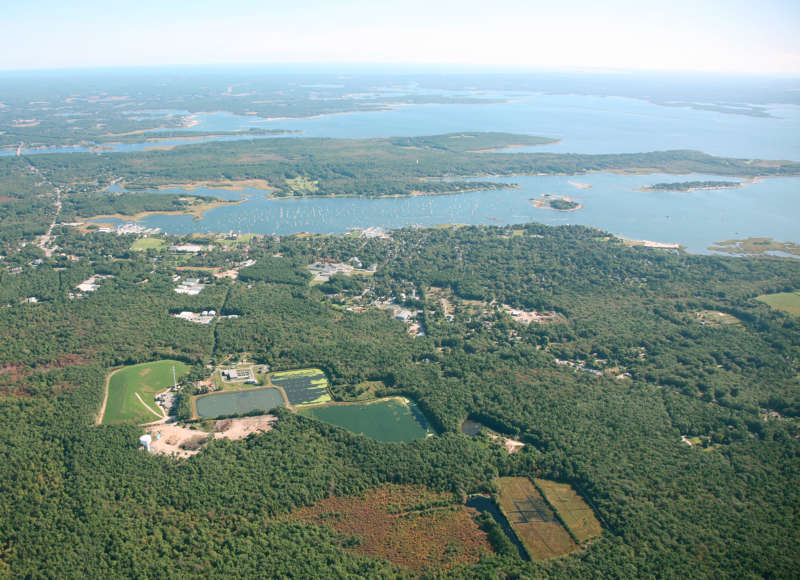 Aerial view of the sewage lagoons at the Marion wastewater treatment plant and nearby Sippican Harbor.
