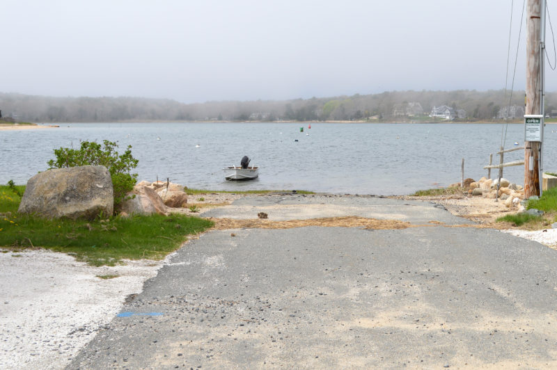 A small boat tied up at the Massasoit Avenue launch in Bourne.