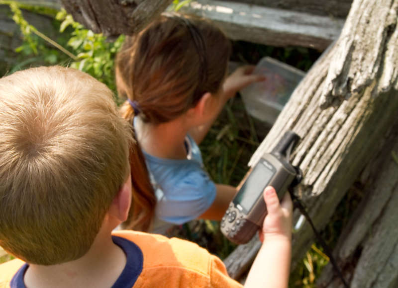 Two children geocaching on a farm in Maryland.