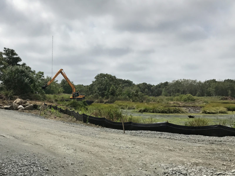 EPA cleanup contractors removing contaminated sediment from the shoreline of Marsh Island in inner New Bedford Harbor in 2017