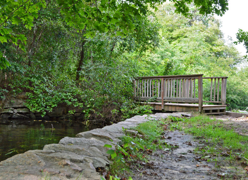 small footbridge across Herring River at Carter Beal Conservation Area in Bourne