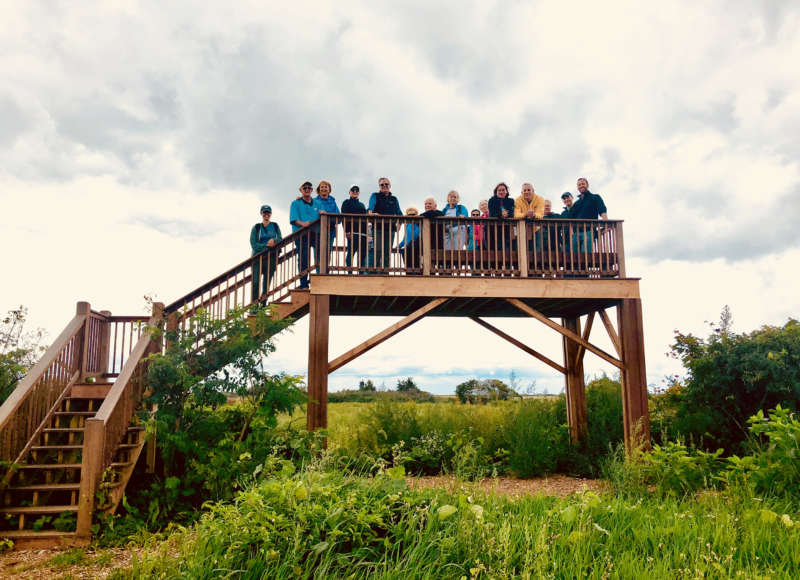 A group of people standing on the observation platform at Ocean View Farm Reserve in Dartmouth.