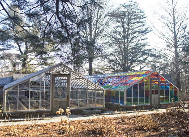 One clear-paned, one rainbow-paned greenhouse on the grounds of Allen C. Haskell Public Gardens in New Bedford