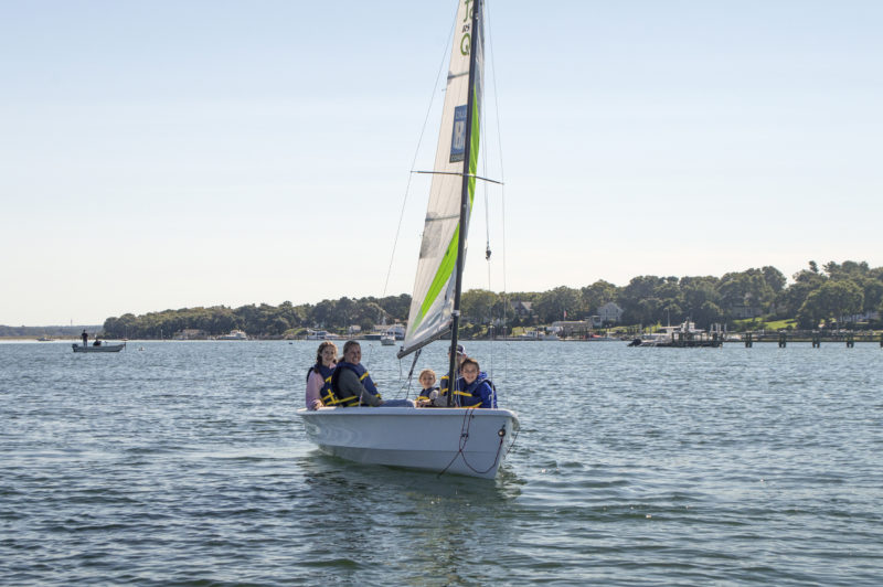 A family sailing on one of the Coalition boats
