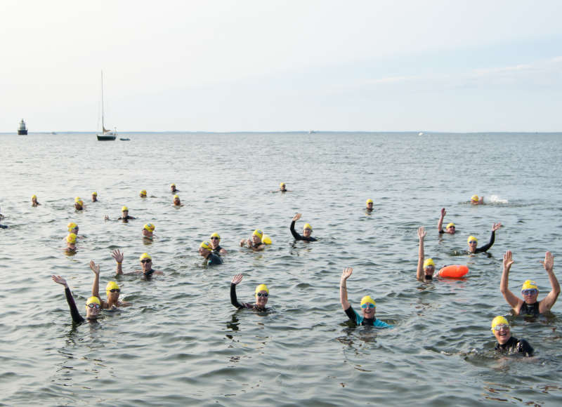 Swimmers in the 2019 Buzzards Bay Swim at the start line in outer New Bedford Harbor