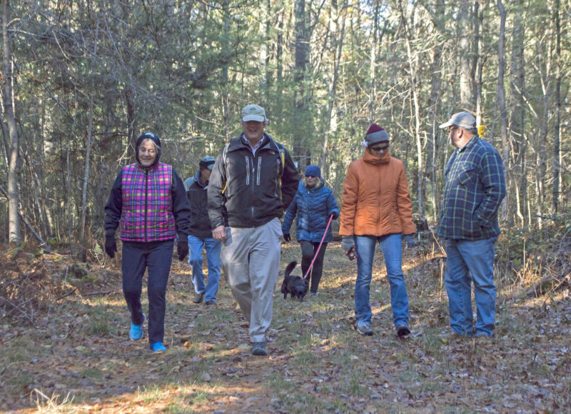 A group of people walking on the trail at Hagemann Woods in Marion