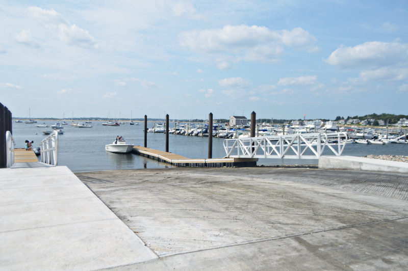 The concrete ramp and floating docks at Monument Beach Marina in Bourne