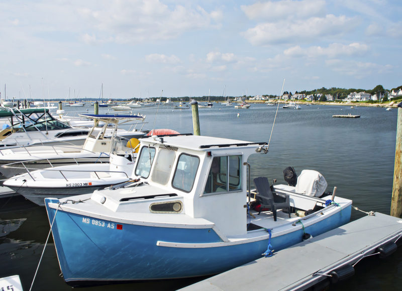 Boats tied up in slips at Monument Beach Marina in Bourne