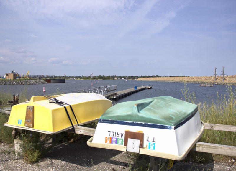 Two dinghys on a storage rack at the Gifford Street Boat Ramp