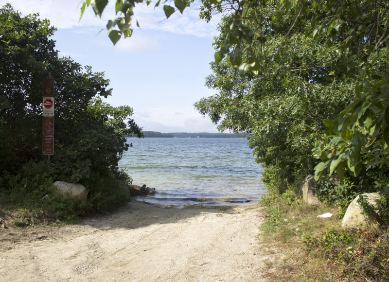 Sandy boat ramp leading into the waters of Great Herring Pond Boat Ramp