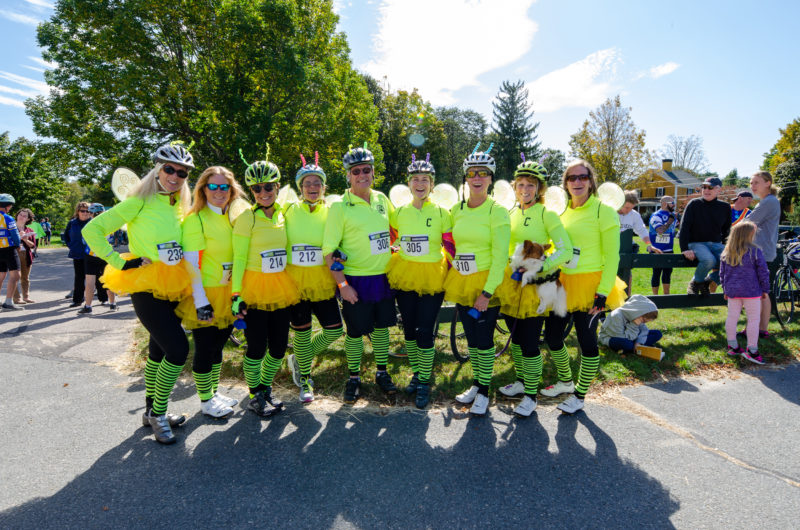 Group of people in yellow costumes at East Over Farm in Rochester.