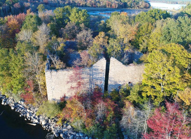 An aerial fall view of the stone walls of the old ice house