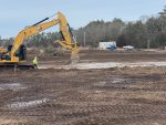 A construction vehicle works on the Mattapoisett Bogs restoration site
