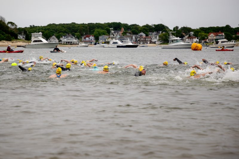 Swimmers head out into Onset Bay from the Shell Point Beach start.