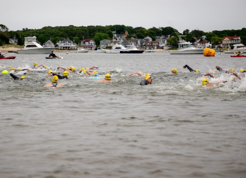 Swimmers head out into Onset Bay from the Shell Point Beach start.