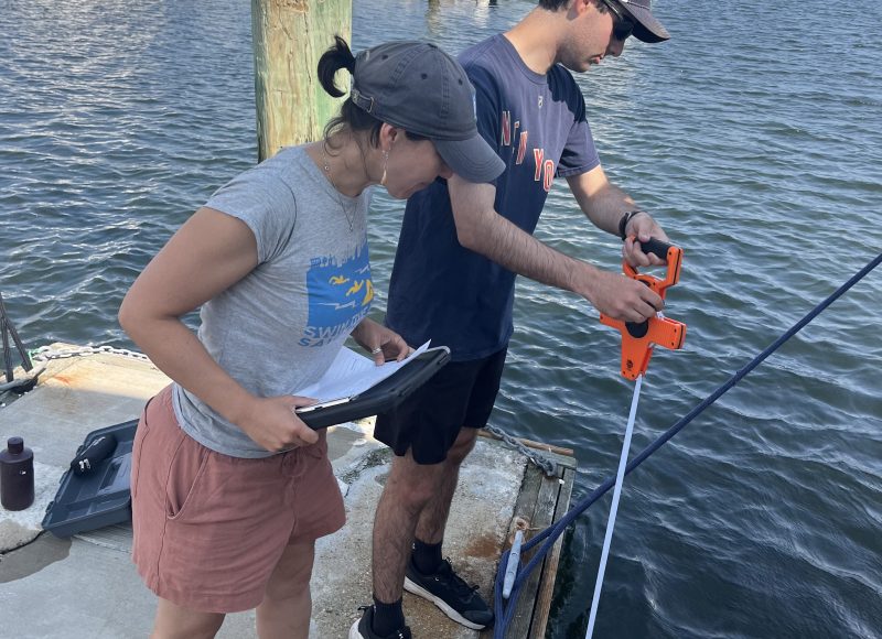 Sara Quintal and Summer intern Caleb Friedman measure water clarity