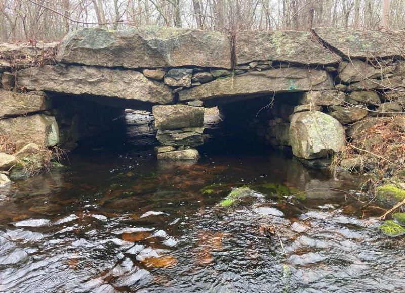 Outlet of the culvert on Angeline Brook at Cornell Road in Westport showing the three-sided open bottom stone structure.