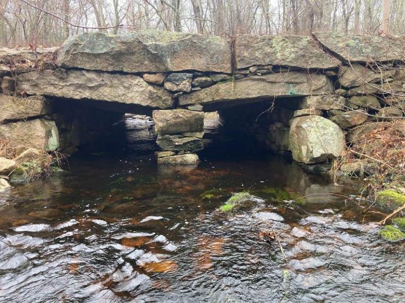 Outlet of the culvert on Angeline Brook at Cornell Road in Westport showing the three-sided open bottom stone structure.